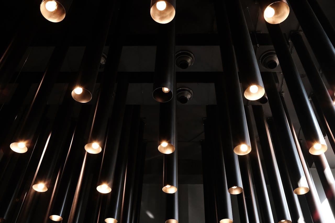 Artistic view of a modern ceiling lighting installation in a Tbilisi café.